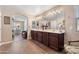 Charming bathroom boasts double sinks with tile flooring and good lighting at 20728 W Legend Trl, Buckeye, AZ 85396