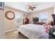 Comfortable bedroom with carpet, ceiling fan, and dresser, perfect for relaxation at 20728 W Legend Trl, Buckeye, AZ 85396