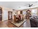 Inviting dining area featuring a large table, elegant chairs, and ample natural light at 20728 W Legend Trl, Buckeye, AZ 85396
