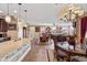 Open floor plan featuring a stylish dining area seamlessly connected to the kitchen and living spaces at 20728 W Legend Trl, Buckeye, AZ 85396