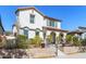 Beautiful two-story home featuring a red tile roof, arched entry, stucco walls, and a landscaped front yard at 20728 W Legend Trl, Buckeye, AZ 85396