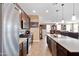 Spacious kitchen features stainless steel appliances and a large center island perfect for cooking and entertaining at 20728 W Legend Trl, Buckeye, AZ 85396