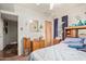 This bedroom features a comfortable bed, a mirror, and light coming in through the windows at 2315 N 12Th St, Phoenix, AZ 85006