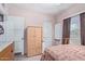 Bedroom with a wooden wardrobe, a window, and a cozy atmosphere at 2315 N 12Th St, Phoenix, AZ 85006