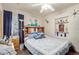 Inviting bedroom with blue accents, built-in shelving, and natural light at 2315 N 12Th St, Phoenix, AZ 85006