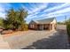 Brick home showing off a paved driveway, tidy landscaping and cozy front porch under a bright blue sky at 2315 N 12Th St, Phoenix, AZ 85006