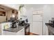 Kitchen with a view to the dining room featuring a gas range and black appliances at 2315 N 12Th St, Phoenix, AZ 85006