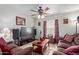 Cozy living room featuring comfortable brown sofas, a large television, and vintage-style decor at 2315 N 12Th St, Phoenix, AZ 85006