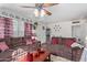 Cozy living room offering comfortable seating, a ceiling fan, and vintage decor touches at 2315 N 12Th St, Phoenix, AZ 85006