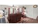 Cozy living room with a large, comfortable brown sofa, hardwood floors, and vintage decor elements at 2315 N 12Th St, Phoenix, AZ 85006