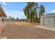 Expansive backyard with a shed and mature tree, providing a private and functional outdoor space at 248 S 95Th Pl, Chandler, AZ 85224