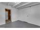 Unfinished basement with painted walls, access door, and painted ceiling rafters at 248 S 95Th Pl, Chandler, AZ 85224