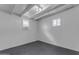 Unfinished basement with painted walls, window allowing natural light, and air conditioner at 248 S 95Th Pl, Chandler, AZ 85224
