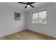 Cozy bedroom featuring a bright window and wood-look floors for a modern touch at 248 S 95Th Pl, Chandler, AZ 85224
