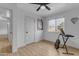 Bedroom with wood-look floors, neutral walls, and a window with a view of the outside at 248 S 95Th Pl, Chandler, AZ 85224