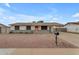 Charming single-story home featuring a nicely landscaped front yard and a pink front door at 248 S 95Th Pl, Chandler, AZ 85224