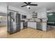 Bright kitchen with stainless steel appliances, white cabinets, and butcher block countertops at 248 S 95Th Pl, Chandler, AZ 85224