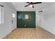 Inviting living room with stylish wood panel wall, ceiling fan, and wood-look flooring at 248 S 95Th Pl, Chandler, AZ 85224