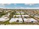 An aerial view of a residential neighborhood showing the white roofs and Phoenix skyline at 2509 N 61St Way, Scottsdale, AZ 85257