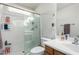 Clean bathroom features a shower, toilet, and sink with wood cabinets at 26111 W Yukon Dr, Buckeye, AZ 85396
