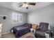 Simple bedroom with gray walls, carpet, and window with blinds at 26111 W Yukon Dr, Buckeye, AZ 85396