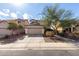 Charming two-story home with a two-car garage and desert landscaping at 26111 W Yukon Dr, Buckeye, AZ 85396