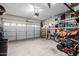 Spacious garage with shelves, storage and two parked motorcycles at 26111 W Yukon Dr, Buckeye, AZ 85396