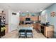 Well-lit kitchen featuring modern appliances, granite countertops, tile backsplash and center island with seating at 26111 W Yukon Dr, Buckeye, AZ 85396