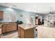 Spacious kitchen with granite countertops, tile floors, and an adjacent dining area at 26111 W Yukon Dr, Buckeye, AZ 85396