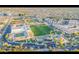 Aerial view of the community showcasing the school, sports field, pool, and surrounding residential areas at 2733 E Virginia St, Gilbert, AZ 85296