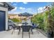 Outdoor dining area with seating, lush greenery, and a view of the swimming pool at 2733 E Virginia St, Gilbert, AZ 85296
