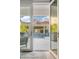 An outdoor space featuring an outdoor pool and lounging area, viewed from inside through french doors at 2733 E Virginia St, Gilbert, AZ 85296