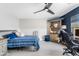 Comfortable bedroom featuring a desk, shelving, and a ceiling fan at 2733 E Virginia St, Gilbert, AZ 85296
