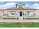 Inviting two-story home with a covered front porch and manicured lawn, blending classic charm and modern appeal at 2733 E Virginia St, Gilbert, AZ 85296