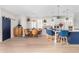 Open-concept kitchen features an island with blue stools and adjacent dining area at 2733 E Virginia St, Gilbert, AZ 85296