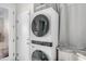 Laundry room features stacked washer and dryer with ample countertop space at 2733 E Virginia St, Gilbert, AZ 85296