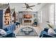 Stylish living room with a cozy fireplace, designer furniture, and elegant decor at 2733 E Virginia St, Gilbert, AZ 85296