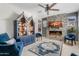 Comfortable living room with a fireplace, stylish seating, and an open layout at 2733 E Virginia St, Gilbert, AZ 85296