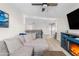 Bright living room showcasing a large sectional sofa and a modern entertainment center with a fireplace at 2733 E Virginia St, Gilbert, AZ 85296
