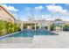 Backyard pool with a pergola, water features, lush landscaping, and ample seating at 2733 E Virginia St, Gilbert, AZ 85296