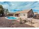 Backyard with a pool, patio, and landscaping with rocks at 30427 W Vale Dr, Buckeye, AZ 85396