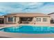Beautiful backyard featuring a private pool and covered patio at 30427 W Vale Dr, Buckeye, AZ 85396