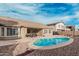 Backyard pool with outdoor seating and a covered patio at 30427 W Vale Dr, Buckeye, AZ 85396