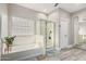 Bathroom featuring a bathtub, shower, and mirrored closet door at 30427 W Vale Dr, Buckeye, AZ 85396