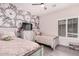 Bedroom with two beds, a ceiling fan, and floral wallpaper at 30427 W Vale Dr, Buckeye, AZ 85396
