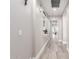 Long hallway featuring wood-look flooring and neutral paint at 30427 W Vale Dr, Buckeye, AZ 85396