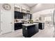 Kitchen featuring black cabinetry, stainless appliances, white countertops, and ample storage at 30427 W Vale Dr, Buckeye, AZ 85396