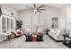 Bright living room featuring vaulted ceilings, stylish decor, and neutral color palette at 30427 W Vale Dr, Buckeye, AZ 85396
