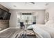 Cozy main bedroom featuring a ceiling fan, bay window, and decor at 30427 W Vale Dr, Buckeye, AZ 85396