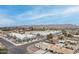 Newer townhomes alongside traditional homes in a vibrant community with mountain views at 325 W Vineyard Rd, Phoenix, AZ 85041